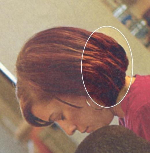 Glued woman's hair?